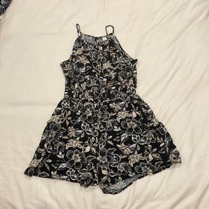 Romper with a flower pattern in size small
